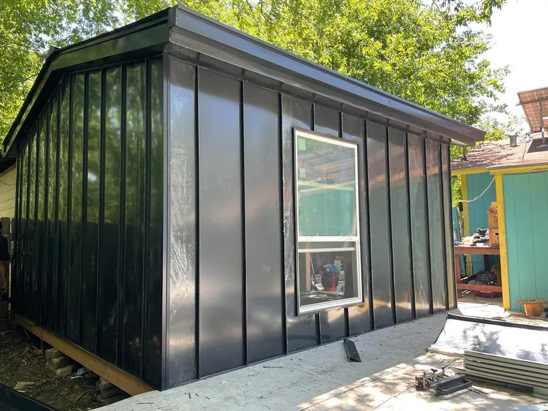 Black standing seam metal wall panels for Roof Inspection in Jan Phyl Village